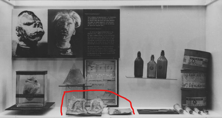 A display case with a picture of a person's head

AI-generated content may be incorrect.