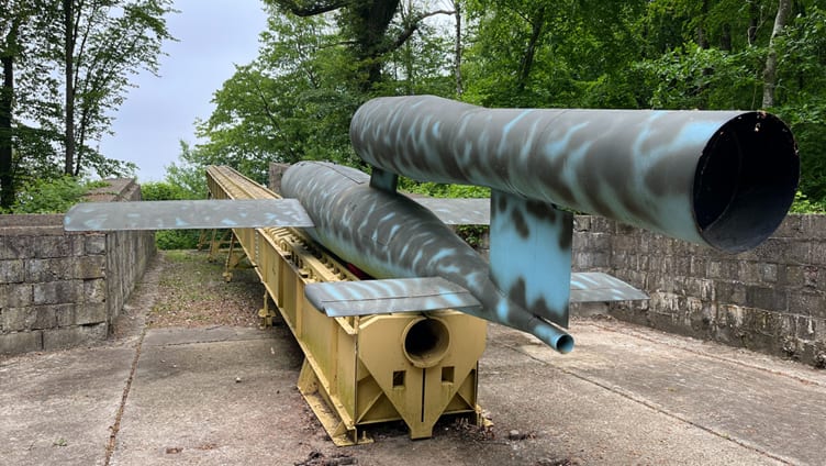 A large metal object with a blue and black paint on it

AI-generated content may be incorrect.