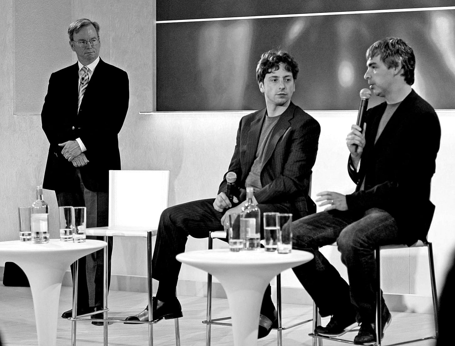Eric Schmidt, Sergey Brin, and Larry Page sitting together