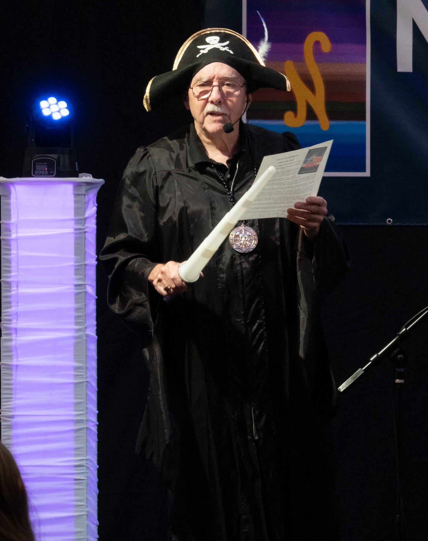 Photo of Dr. Darrel Ray in a pirate hat giving the Pastafarian invocation