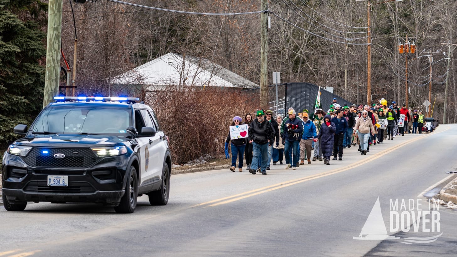 May be an image of road, crowd and text that says '¥9046 BOVER MADE DOVER'