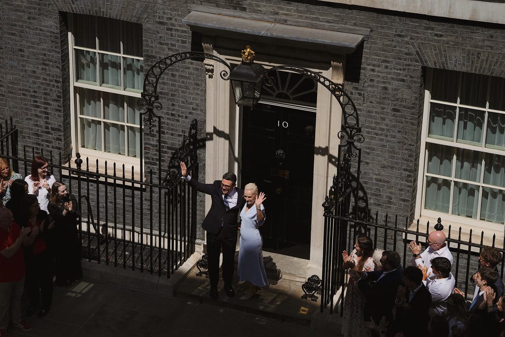 Andy Burnham and Marie-France van Heel on the steps of 10 Downing Street