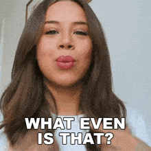 a woman blowing a kiss with the words what even is that above her