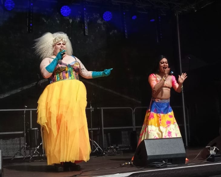 Two performers on stage at Croydon Pride
