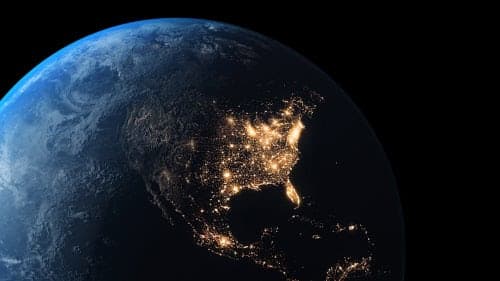 Lights illuminate Earth viewed from space.
