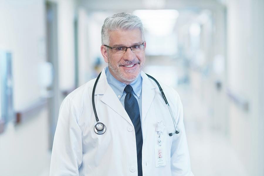 Stereotypical-looking doctor wearing glasses.