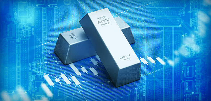 Three polished silver bars rest over a glowing digital market chart, symbolizing rising industrial demand, tightening supply, and silver’s growing role as a scarce hard asset amid inflation, market volatility, and increasing pressure on traditional retirement portfolios.
