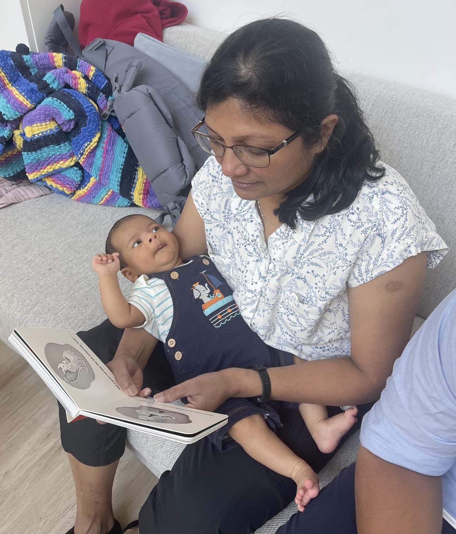 Leo is more interested in his achamma’s face than the book