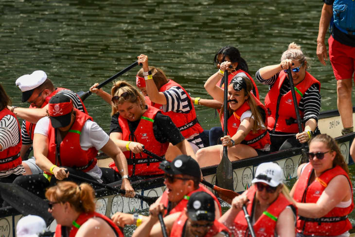 Two dragon boats racing alongside each other