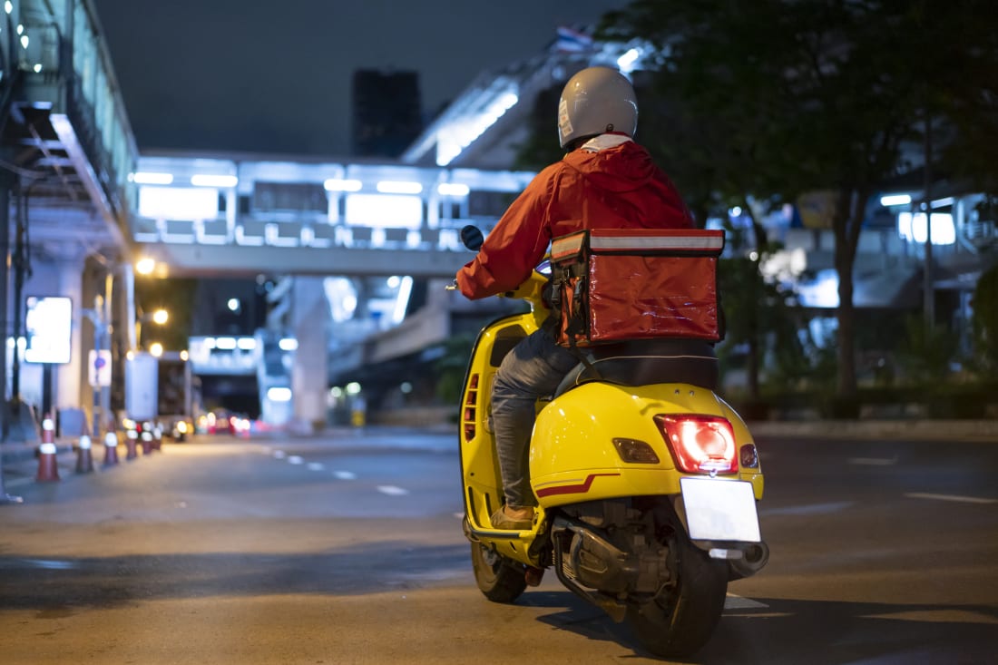 A delivery driver at night