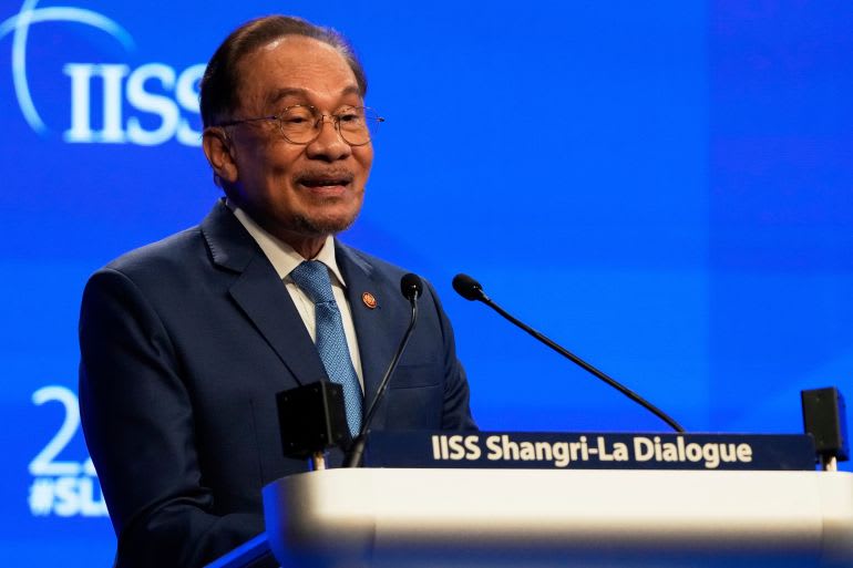 Malaysian Prime Minister Anwar Ibrahim delivers a speech.