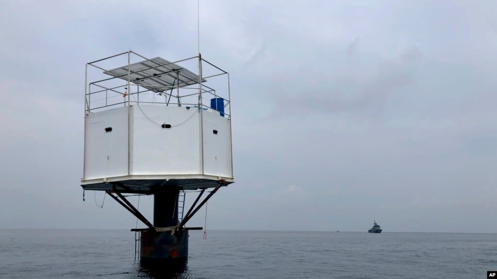 This photo provided by Royal Thai Navy, shows a floating home lived in by an American man and his Thai partner in the Andaman Sea, off Phuket island, Thailand, April 13, 2019.