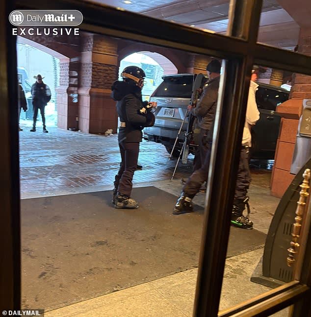 Pictured: Duhon and Paxton stand in a covered driveway of the hotel as the couple prepares to go skiing in Aspen on December 6