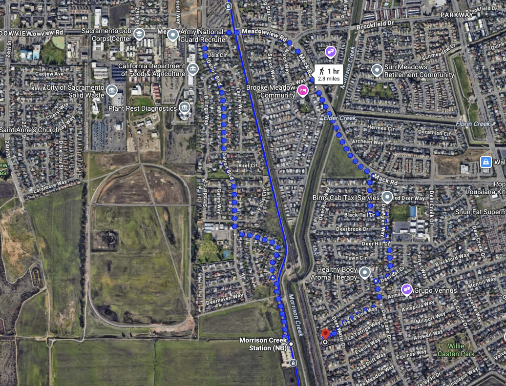 A Google Maps photo showing that it would take an hour or 2.8 miles walking to get from a single-family home to a light rail stop, as they're divided by a river.