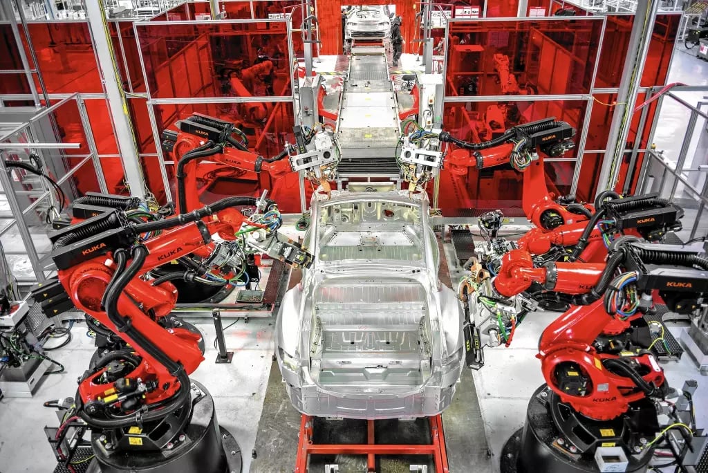 Tesla is spending what Chief Executive Elon Musk called “staggering amounts of money” on gearing up for mass production. Above, robots assemble Model S sedans at the electric car maker’s 5.3-million-square-foot plant in Fremont, Calif. Tesla is spending what Chief Executive Elon Musk called “staggering amounts of money” on gearing up for mass production. Above, robots assemble Model S sedans at the electric car maker’s 5.3-million-square-foot plant in Fremont, Calif.