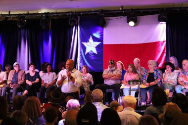 Colin speaking to a crowd of supporters