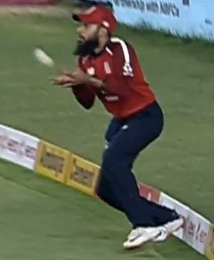 deep fielder near boundary rope cricket outfield deep fielder near boundary rope cricket outfield