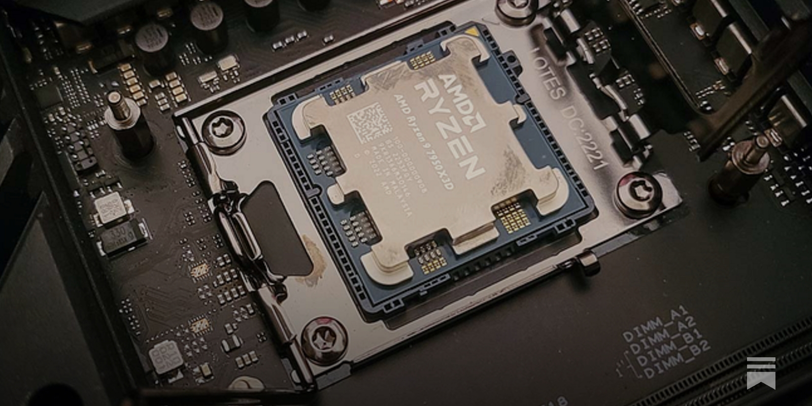 AMD Ryzen 9 7950X3D processor installed in an AM5 motherboard socket, with its gold contact points and heat spreader visible. The surrounding black PCB and labeled DIMM slots highlight the high-end motherboard design for performance computing.