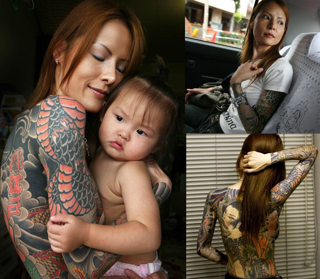 Japanese tattoo artist, Tokumitsu Uchida works over outline of design...  News Photo - Getty Images