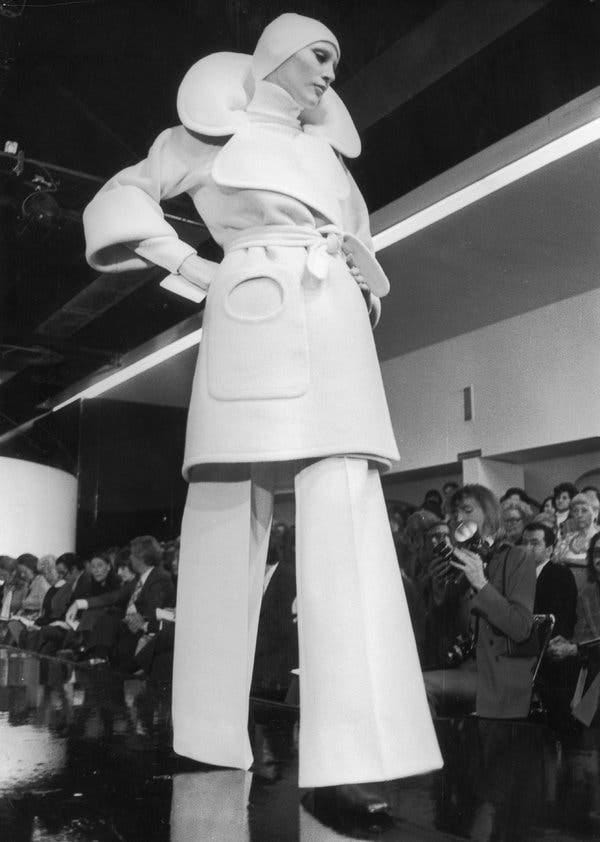 Pierre Cardin mens fashion. Pierre Cardin pictured seated
