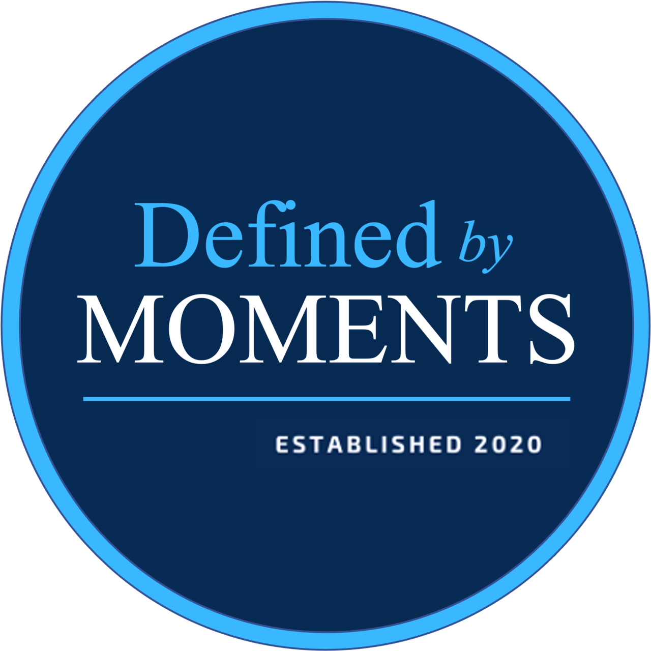 Defined By Moments logo