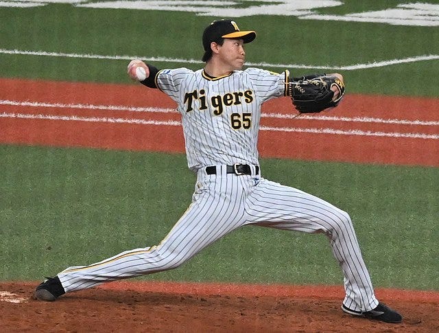 Tohoku Rakuten Golden Eagles manager Yasushi Tao wearing a mask