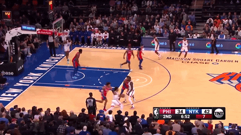 Jimmy Butler climbs the ladder and crushes the one-handed oop