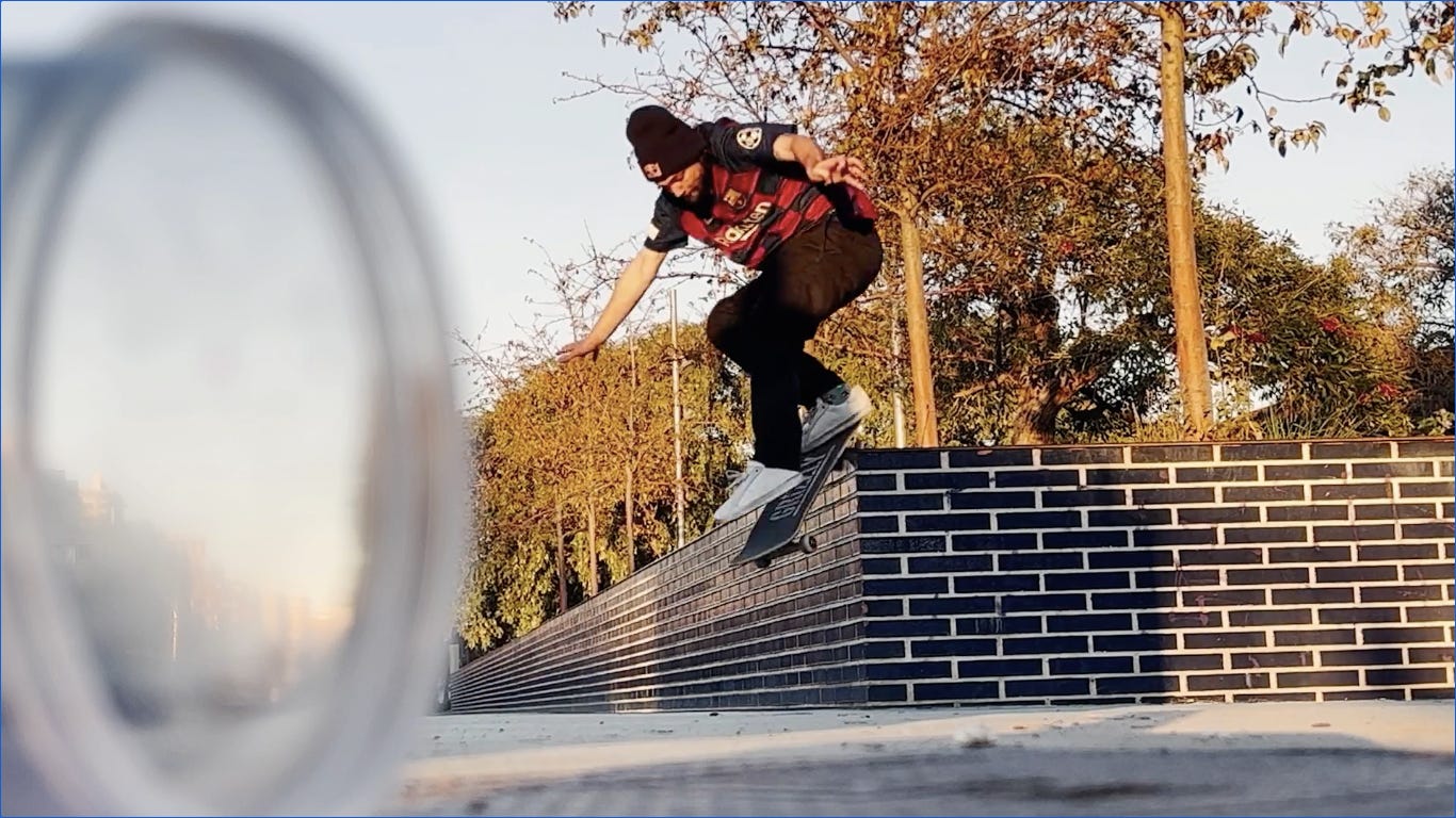 Roller blader female grinding on a ledge in a skatepark. Cool