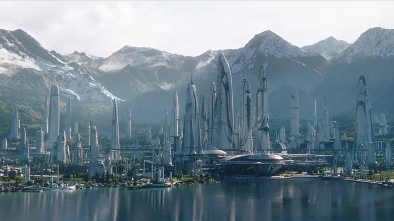 A solarpunk city with white skyscrapers, plants and the ocean nearby