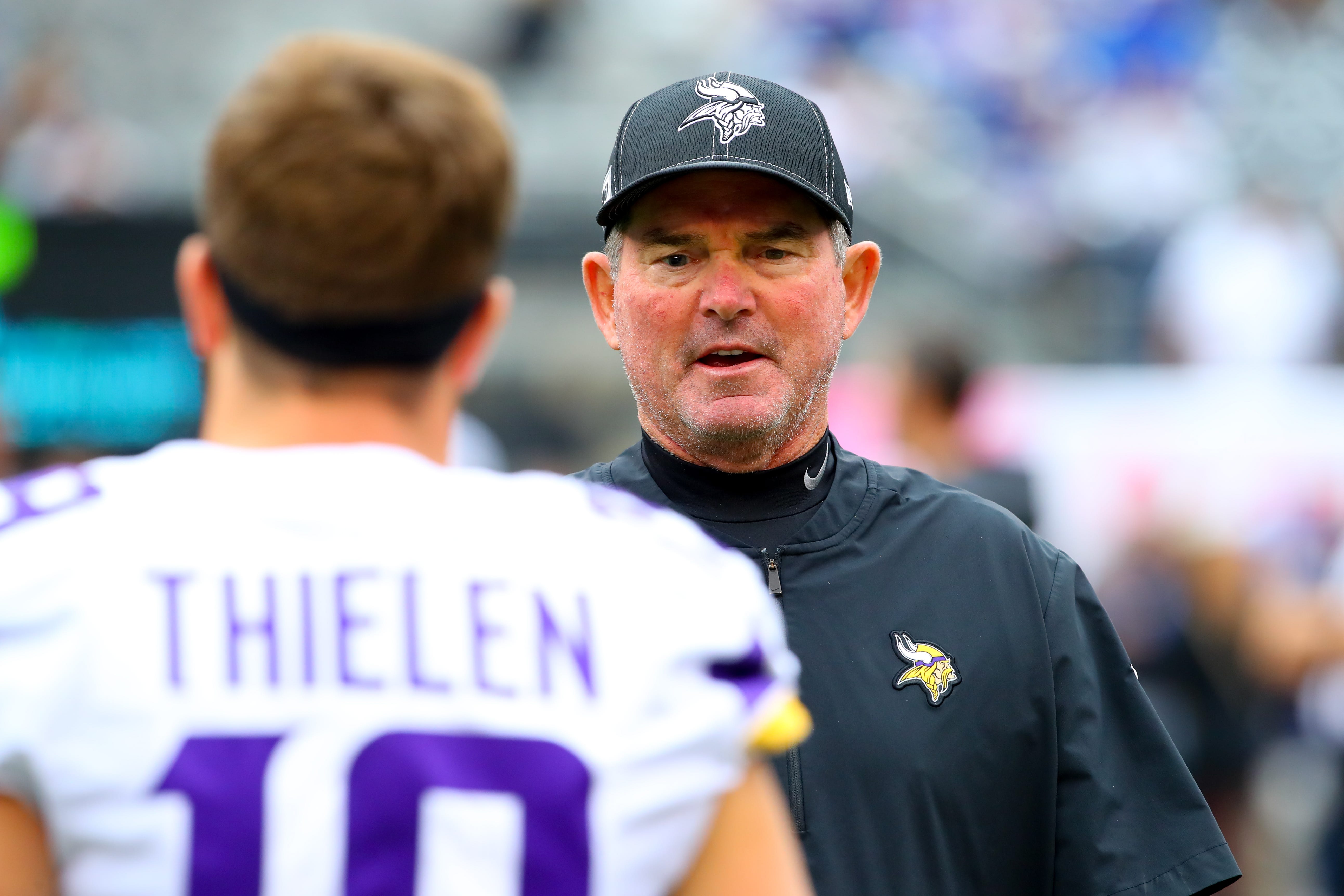 Minnesota Vikings head coach Mike Zimmer, right, shouts out as he