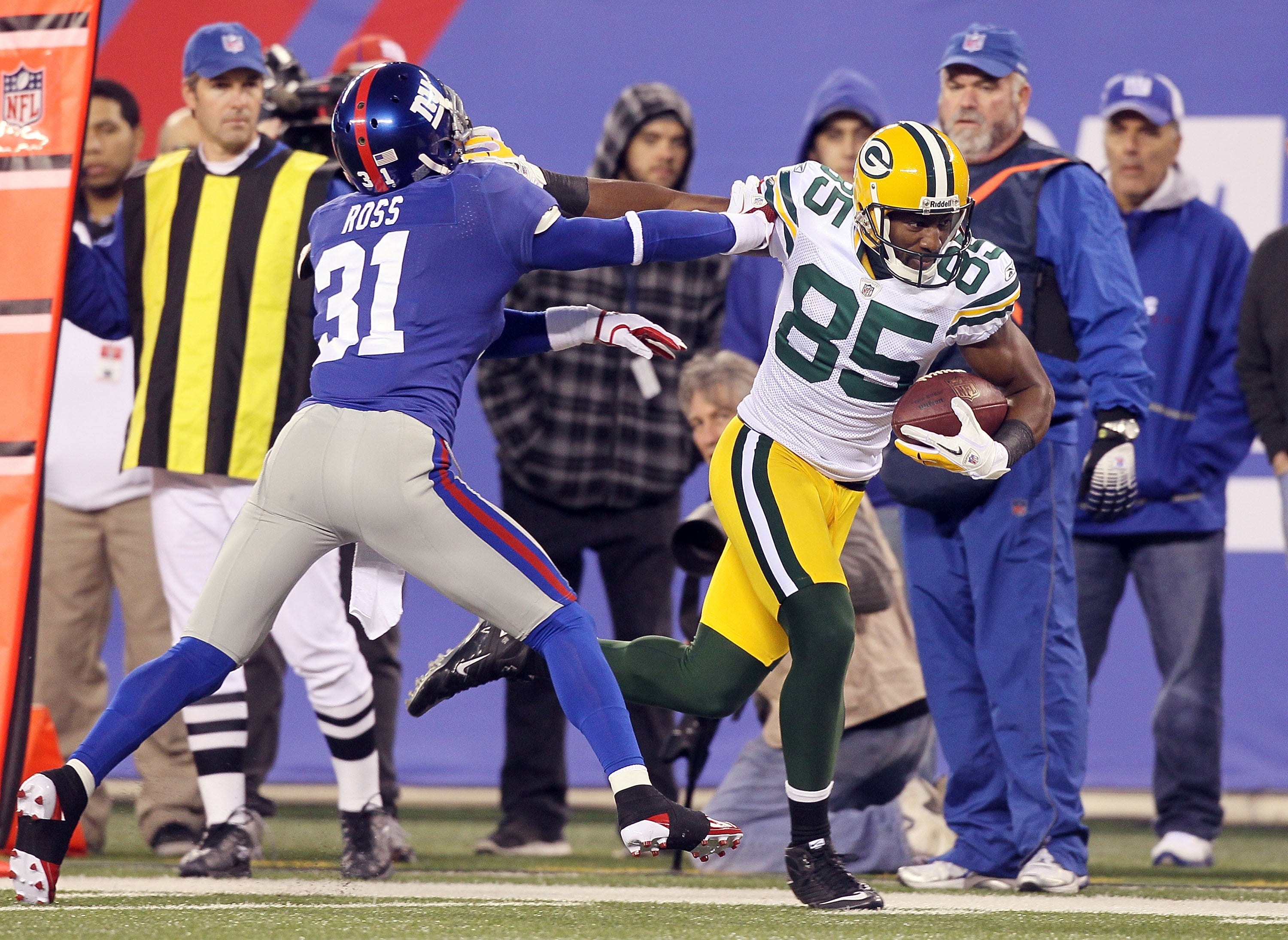 Green Bay Packers wide receiver Sterling Sharpe (84) heads for the end zone  after pulling in a 30-yard Brett Favre touchdown pass during the Packers  game with the Tampa Bay Buccaneers Oct.