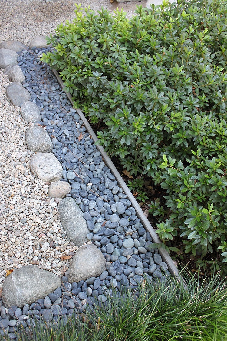 The Tiny Small Rocks All Over The Pave Walk Road On The Backyard