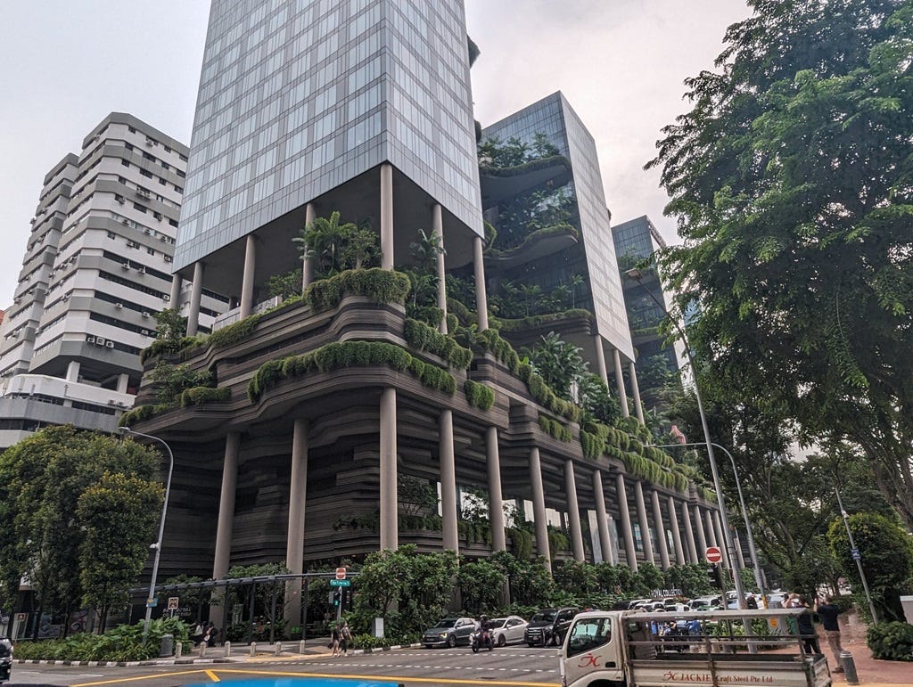 A solarpunk city with white skyscrapers, plants and the ocean nearby