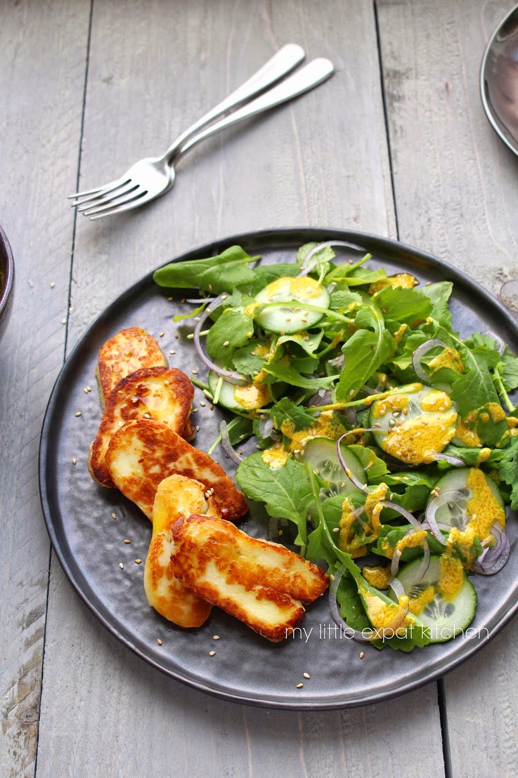 Grilled halloumi with young turnip greens, cucumber and red onion salad ...