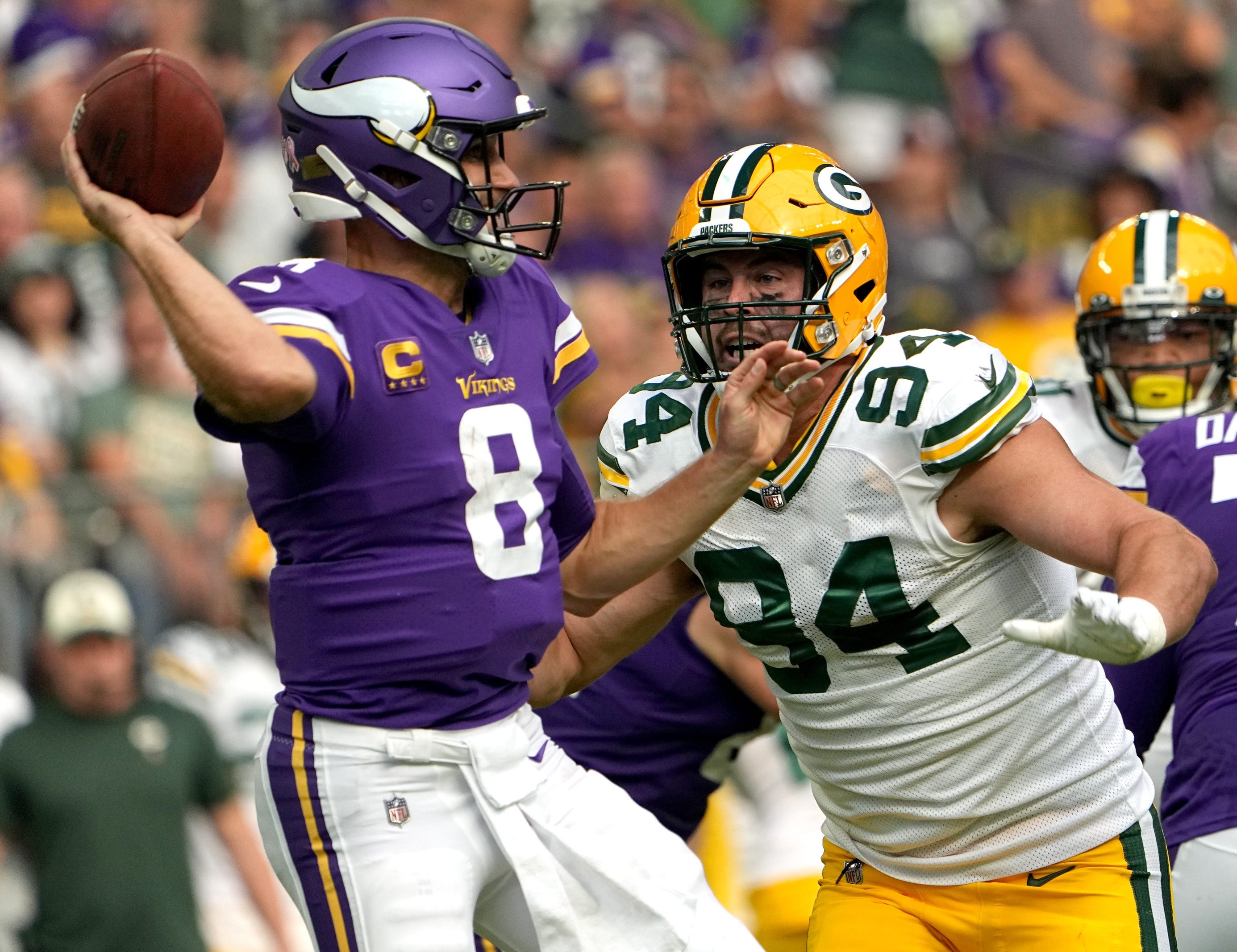 Green Bay Packers defensive end Dean Lowry (94) pressures Minnesota Vikings quarterback Kirk Cousins (8) during the first quarter of their game Sunday, September 11, 2022 at U.S. Bank Stadium in Minneapolis, Minn. © Mark Hoffman / Milwaukee Journal Sentinel / USA TODAY NETWORK
