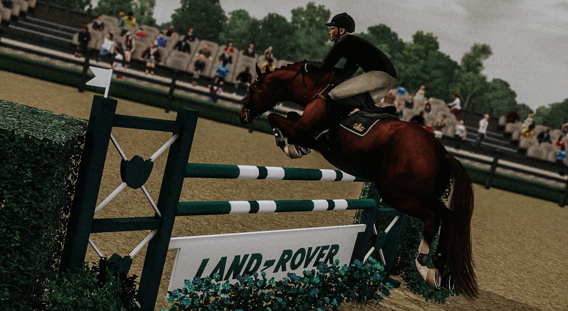 Ryan O'Neil and his horse Icarus soaring over a Land-Rover branded jump at the Yeatman Classic.