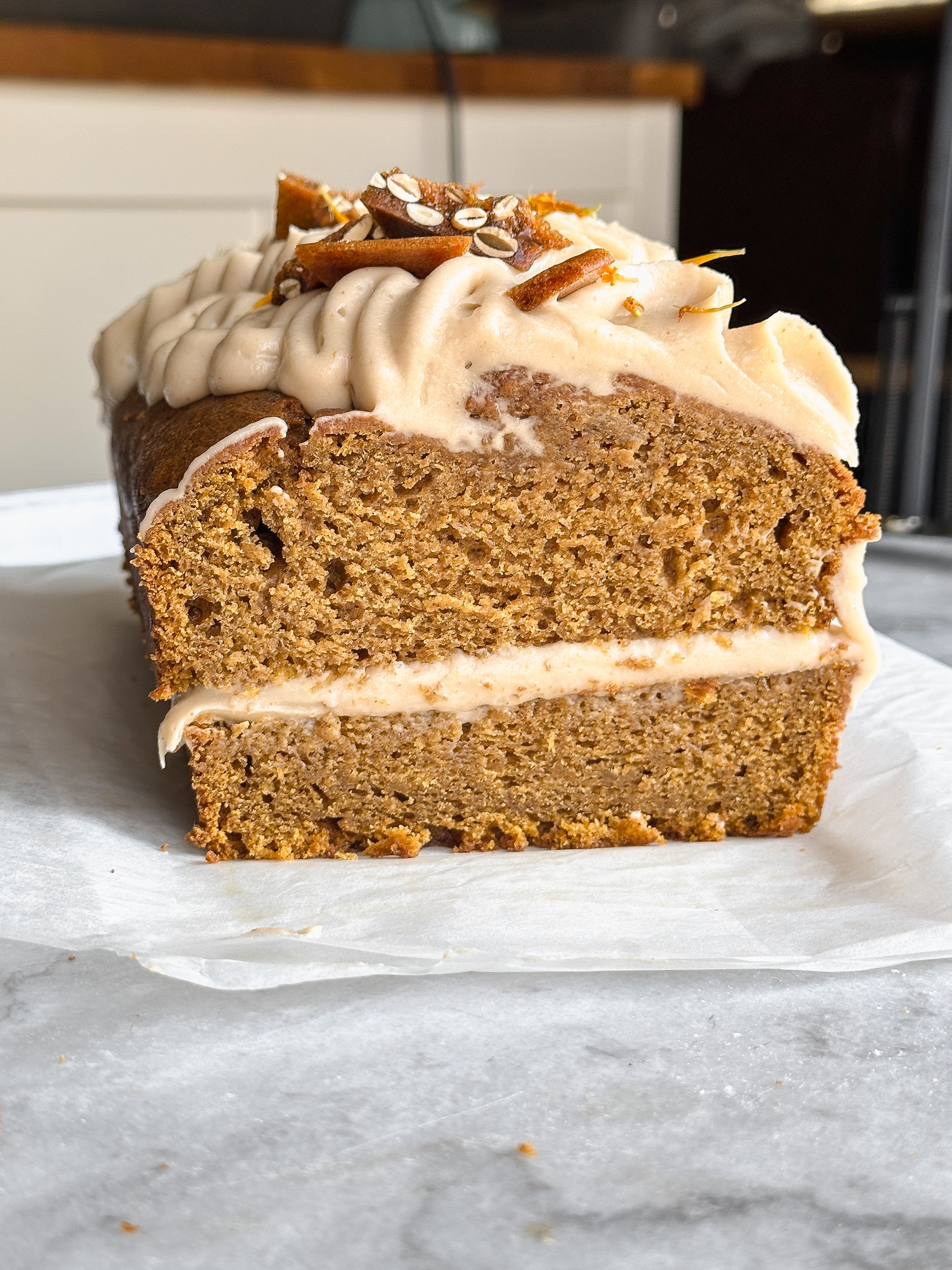 Pumpkin bread with brown butter cream cheese frosting and pepita brittle