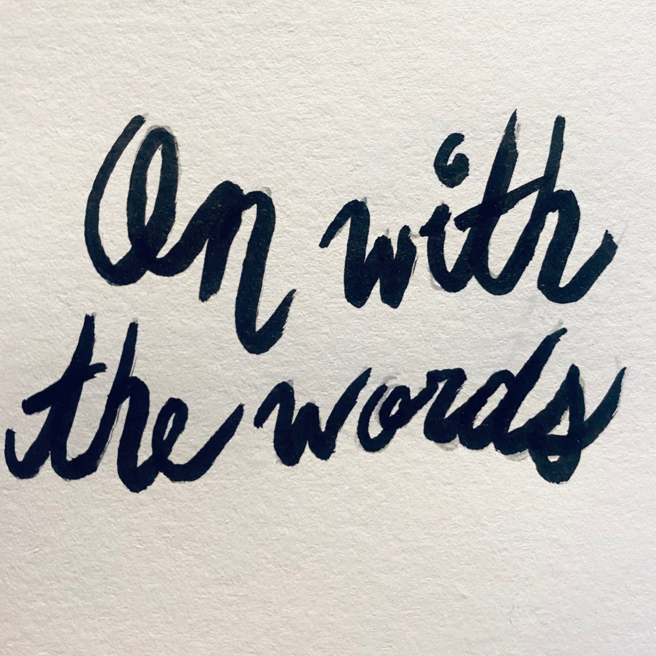 On With The Words logo