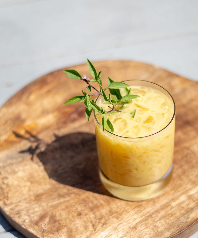 Driveway Drinks Mango Sour with Coconut Milk and Jasmine Tea Vodka