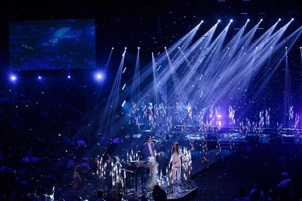 Hillsong Christmas Service Features Woman Swinging from Moon Wearing