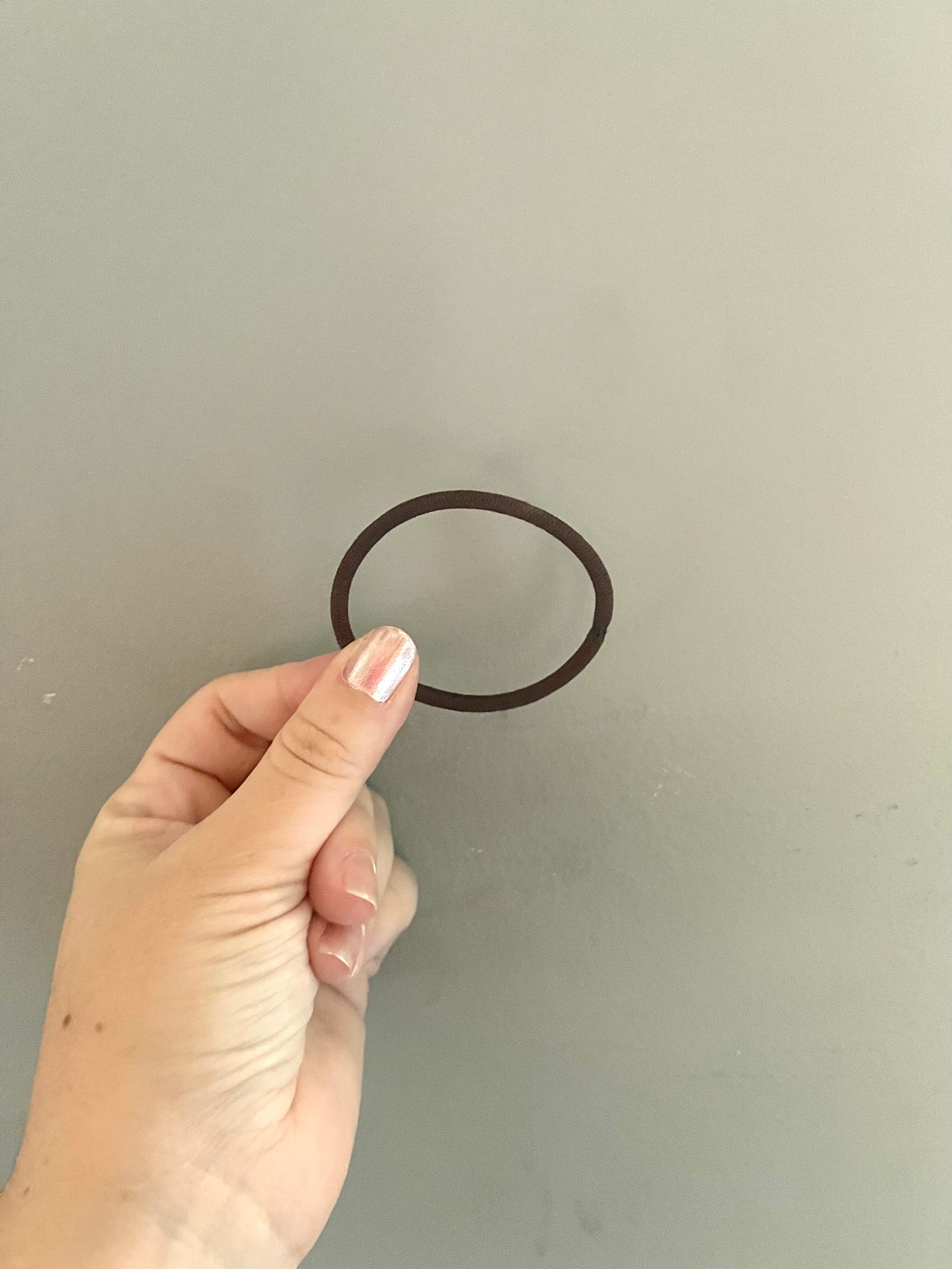 The Process of Breaking in your Elastic Hair Tie.