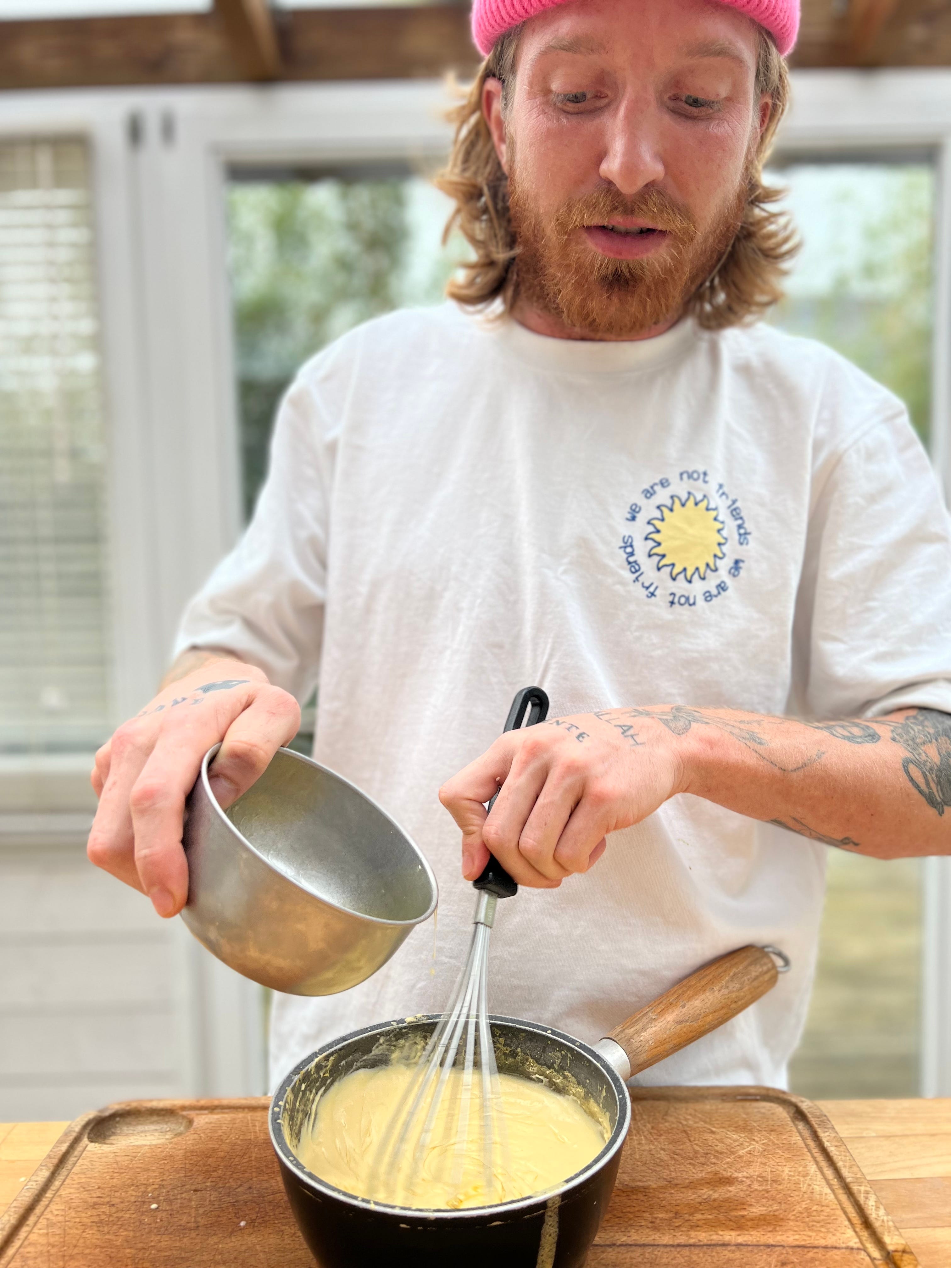 Marinated pointed cabbage with spices, blood orange sabayon and hazelnuts
