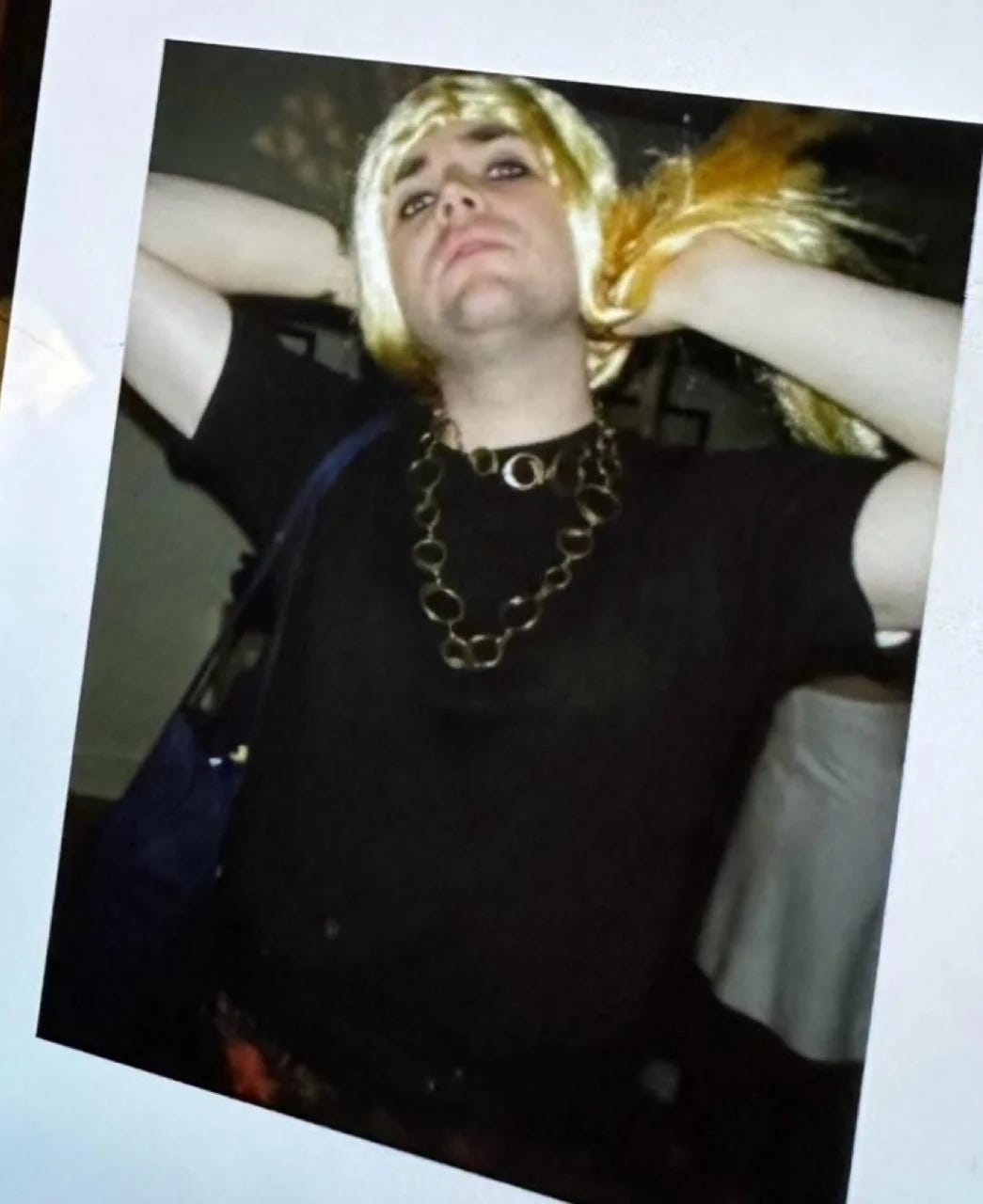 Jd vance in drag with a blonde wig and black eyeliner 