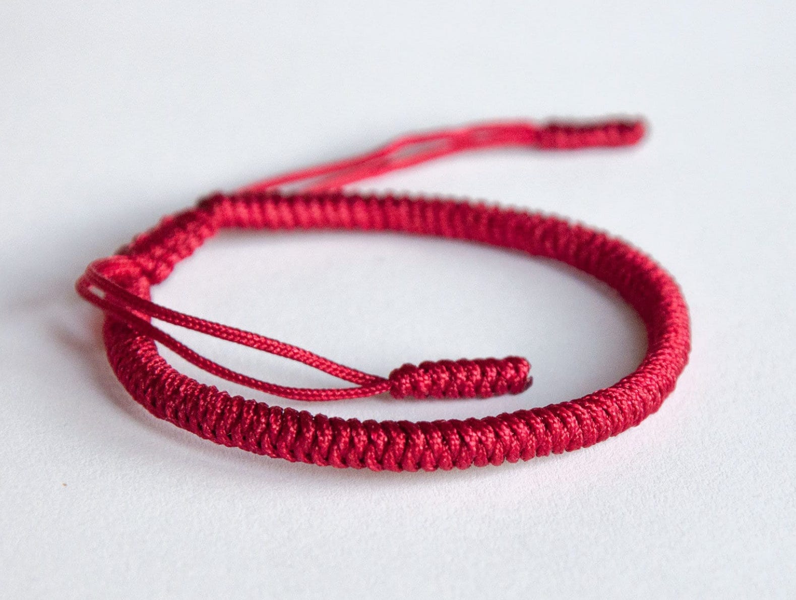 Red thread bracelet buddhist shop