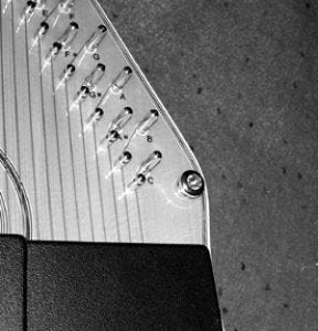Harp with buttons top