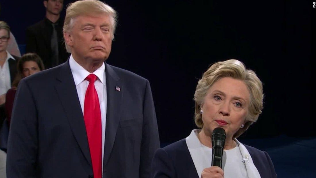 Image result for Trump standing behind Clinton
