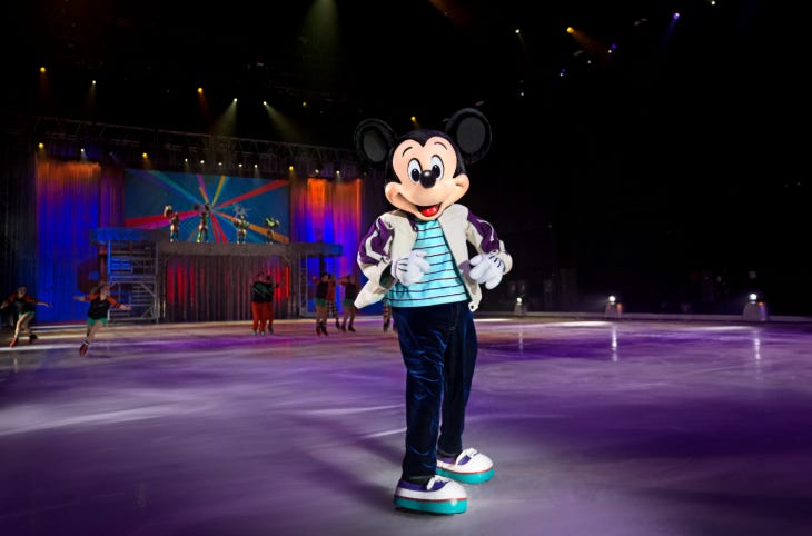 Mickey Mouse on ice skates on an ice rink