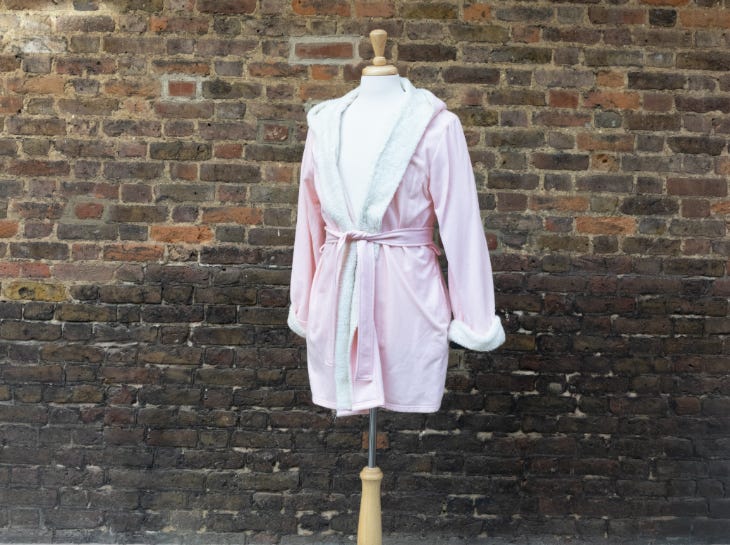 A very short pink dressing gown