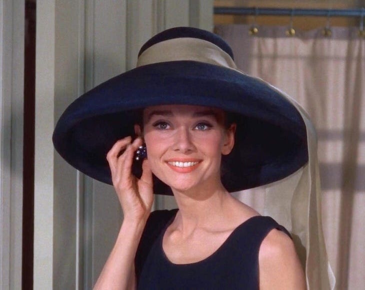 Audrey Hepburn in a big hat in Breakfast at Tiffanys