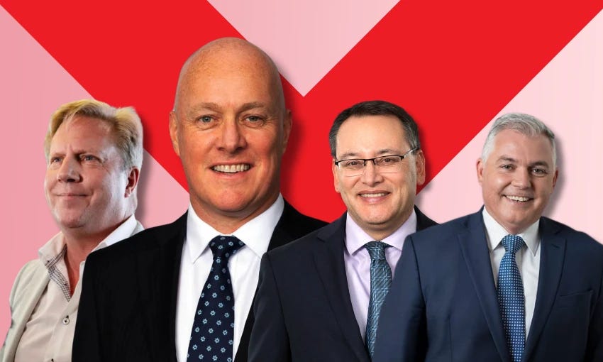 Four men in suits, Todd McClay, Chris Luxon, Shane Reti and Mark Mitchell, in front of a pink background with a big red X to symbolise a no